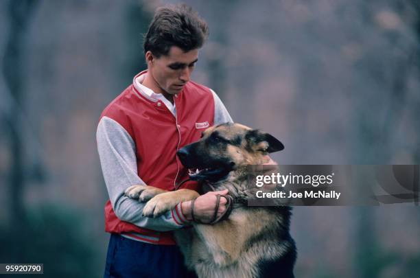 Tennis player Ivan Lendl, a 26 year old Czechoslovakian, pets his German Shepherd Viky, on the grounds of his Greenwich, Connecticut stone mansion,...