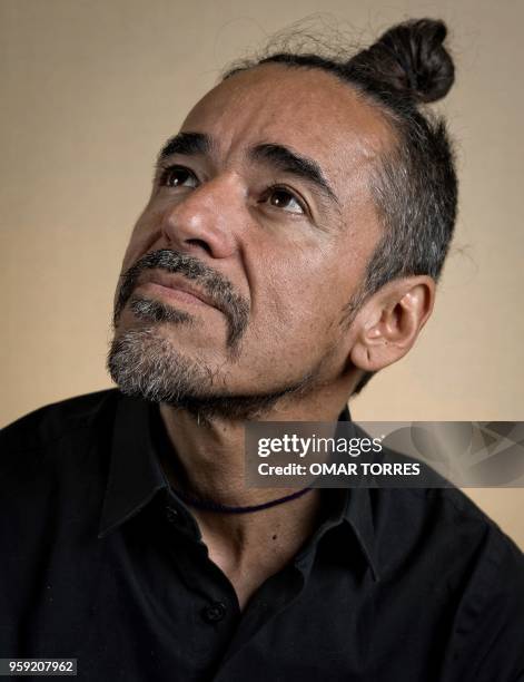 Mexican Ruben Albarran, member of "Cafe Tacvba" rock group, poses for pictures during an interview in Mexico City on April 18, 2018.