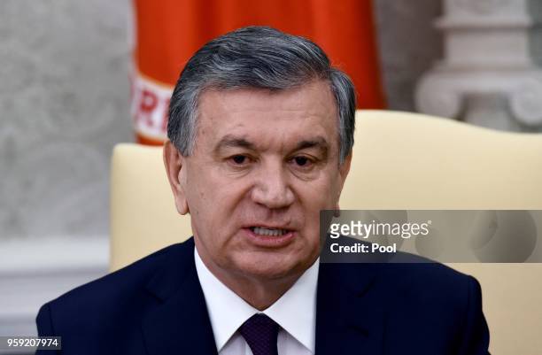 President of the Republic of Uzbekistan Shavkat Mirziyoyev speaks as U.S. President Donald Trump listens during a meeting in the Oval Office of the...