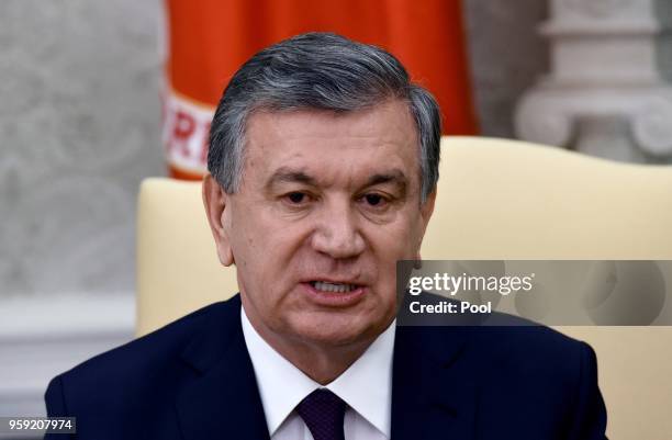 President of the Republic of Uzbekistan Shavkat Mirziyoyev speaks as U.S. President Donald Trump listens during a meeting in the Oval Office of the...