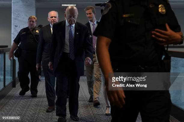 Former CIA director John Brennan and former director of National Intelligence James Clapper leave after a closed hearing before the Senate...