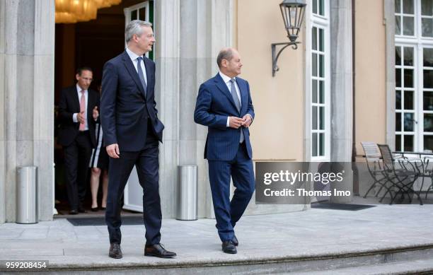 German Finance Minister Olaf Scholz welcomes Bruno Le Maire, France's finance minister, for talks at the Borsig villa in Berlin on May 16, 2018. In...