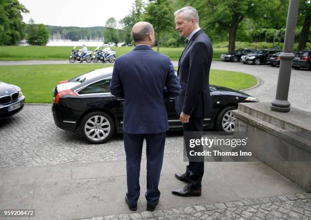 German Finance Minister Olaf Scholz welcomes Bruno Le Maire, France's finance minister, for talks at the Borsig villa in Berlin on May 16, 2018. In...