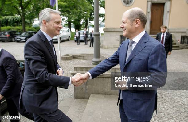 German Finance Minister Olaf Scholz welcomes Bruno Le Maire, France's finance minister, for talks at the Borsig villa in Berlin on May 16, 2018. In...