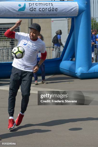 Charity godfather Paris Saint Germain footballer Kylian Mbappe takes part in the "Tous En Bleu" sports workshops organised by the charity "Premiers...