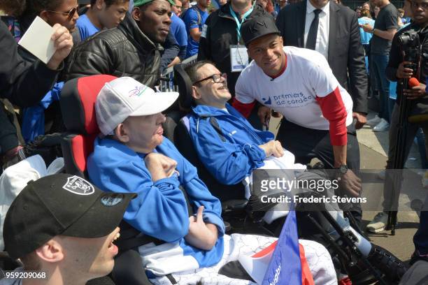 Charity godfather Paris Saint Germain footballer Kylian Mbappe takes part in the "Tous En Bleu" sports workshops organised by the charity "Premiers...