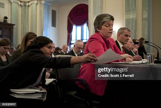 Jan 20: An aide passes a document to Homeland Security Secretary Janet Napolitano, as Napolitano, National Counterterrorism Center Director Michael...