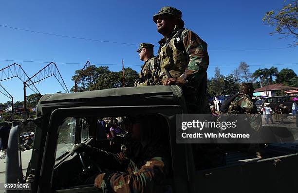 Members of the U.S. Navy arrive in the city of Leogane January 21, 2010 in Leogane, Haiti. The U.S. Navy, U.S. Marine Corps and Canadian Navy are...