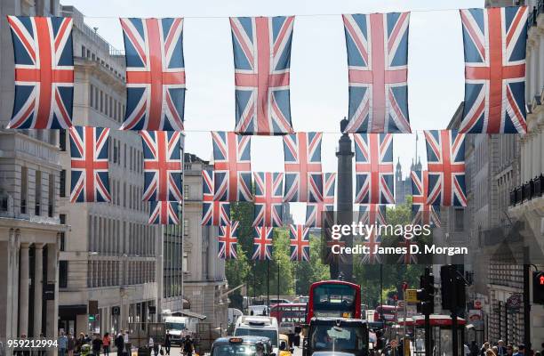 Union Jack flags fly in the sunshine on Regent Street on May 15, 2018 in London, England. The Royal Wedding between Prince Harry and Meghan Markle...