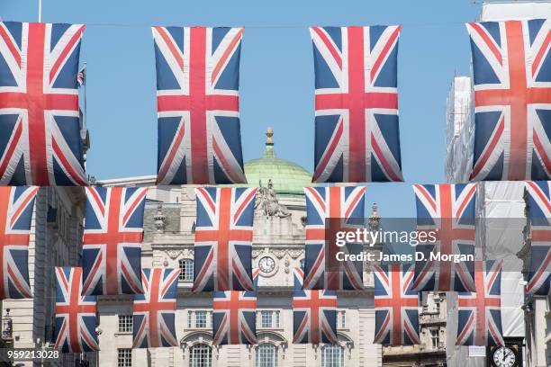 Union Jack flags fly in the sunshine on May 15, 2018 in London, England. The Royal Wedding between Prince Harry and Meghan Markle will be held at...