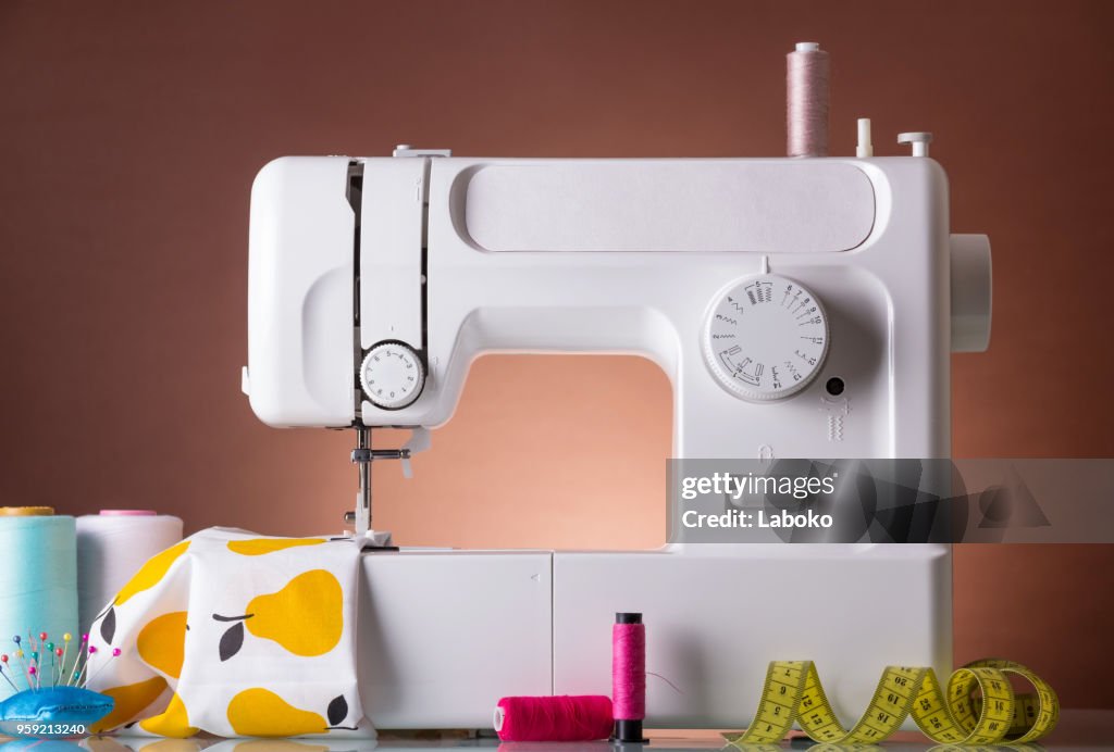 Household sewing machine, accessories, fabric under presser foot