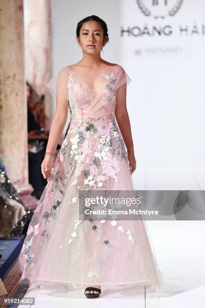 Model presents Celebrity Designer to Miss France and Miss Universe Hoang Hai of Vietnam, at season 3 of Tiffanys Red Carpet Week Cannes Fashion Show...