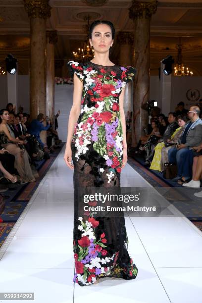 Model presents Celebrity Designer to Miss France and Miss Universe Hoang Hai of Vietnam, at season 3 of Tiffanys Red Carpet Week Cannes Fashion Show...