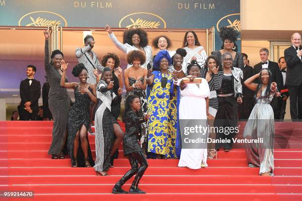 Authors of the book "Noire N'est Pas Mon Métier" pose on the stairs at the screening of "Burning" during the 71st annual Cannes Film Festival at...