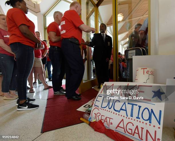 Advocates for education try to get in to the North Carolina House of Representatives on the General Assembly's opening day on May 16, 2018 in...