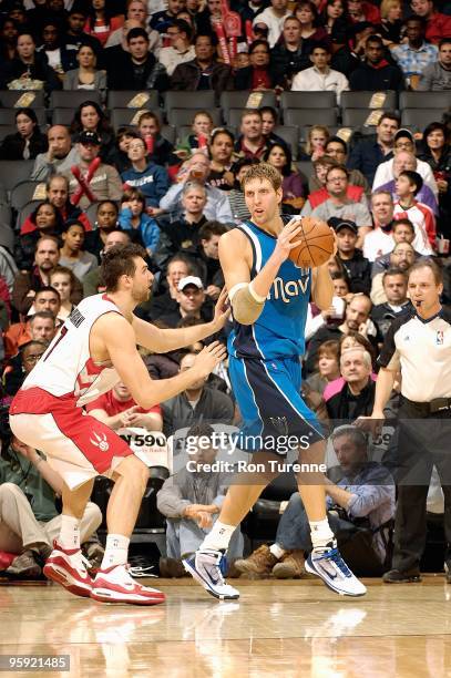 Dirk Nowitzki of the Dallas Mavericks handles the ball against Andrea Bargnani of the Toronto Raptors during the game on January 17, 2010 at Air...