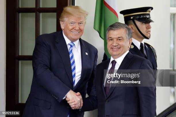 President Donald Trump, left, shakes hands with Shavkat Mirziyoev, Uzbekistan's president, ahead of a bilateral meeting at the White House in...