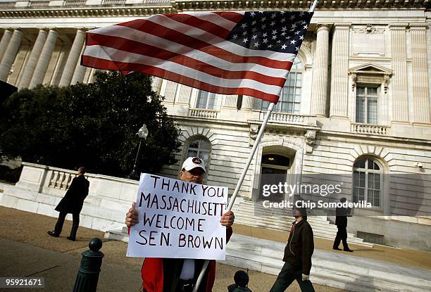 Ron Kirby of Alexandria, Virginia, stands in front of the Russell Senate Office Building on Capitol Hill to show his support for Massachusetts U.S....