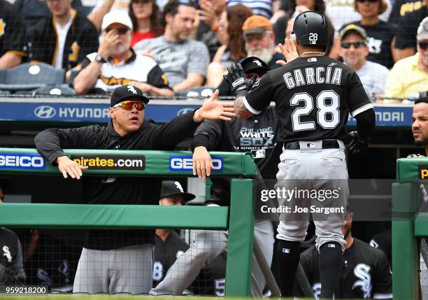 Leury Garcia of the Chicago White Sox celebrates his solo home run with teammates in the second inning against the Pittsburgh Pirates during...