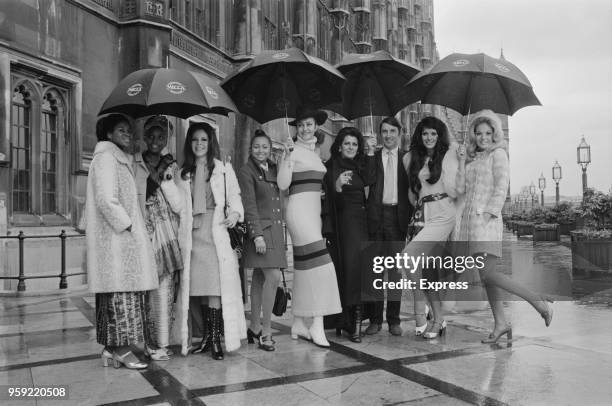 Scottish Liberal Party politician David Steel pictured on the terrace of the Palace of Westminster with contestants for the Miss World 1970 beauty...