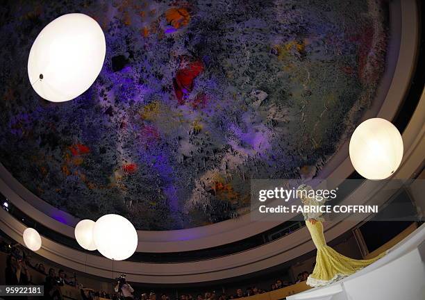 Model presents a creation under the Spanish artist Miquel Barcelo's ceiling painting as part a Biodiversity fashion show at the European headquarters...