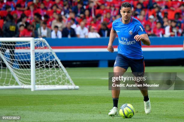 Hatem Ben Arfa runs with ball during a Paris Saint-Germain training session at Parc des Princes on May 16, 2018 in Paris, France.