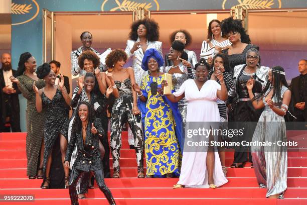 Authors of the book "Noire N'est Pas Mon Métier" dance on the stairs at the screening of "Burning" during the 71st annual Cannes Film Festival at...