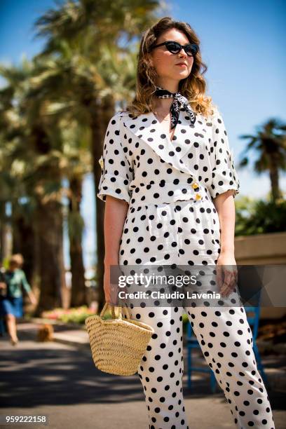 Angelica Ardasheva, wearing a Asos black and white dots dress, is seen in the streets of Cannes during the 71st annual Cannes Film Festival on May...