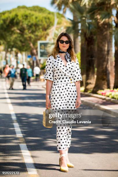 Angelica Ardasheva, wearing a Asos black and white dots dress, is seen in the streets of Cannes during the 71st annual Cannes Film Festival on May...