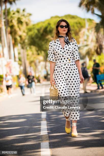 Angelica Ardasheva, wearing a Asos black and white dots dress, is seen in the streets of Cannes during the 71st annual Cannes Film Festival on May...