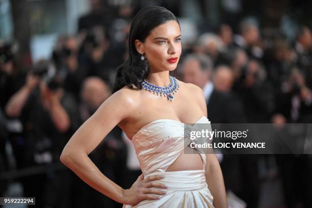 Brazilian model Adriana Lima poses as she arrives on May 16, 2018 for the screening of the film "Burning" at the 71st edition of the Cannes Film...