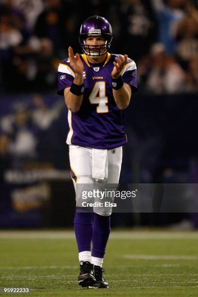 Quarterback Brett Favre of the Minnesota Vikings celebrates a first down while playing against the Dallas Cowboys during the NFC Divisional Playoff...
