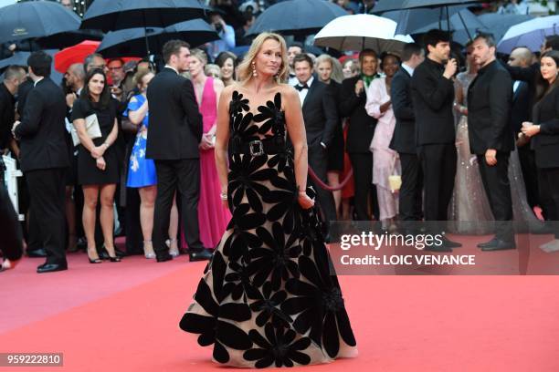 French model Estelle Lefebure poses as she arrives on May 16, 2018 for the screening of the film "Burning" at the 71st edition of the Cannes Film...