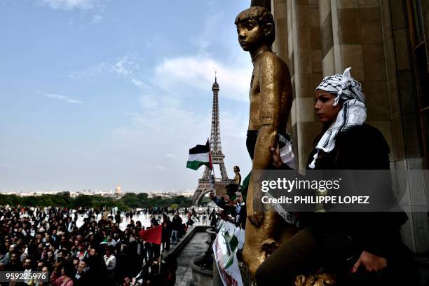 People holding up Palestinian flags rally at the Trocadero in the French capital Paris on May 16 two days after at least 2,400 Palestinians were...