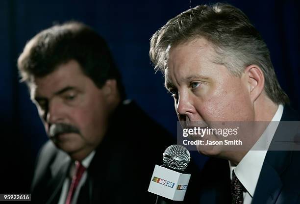 Chairman and CEO Brian France speaks with the media, as NASCAR President Mike Helton looks on, during the NASCAR Sprint Media Tour hosted by...