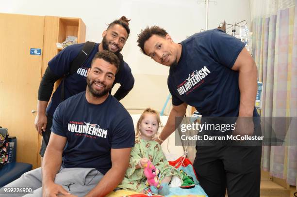 New England Patriots Harvey Langi, Kyle Van Noy, and Derek Rivers visit Macy at Boston Children's Hospital on May 16, 2018 in Boston, Massachusetts.