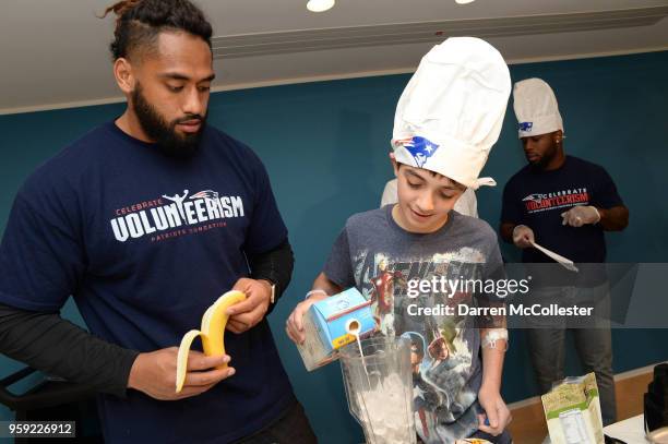 New England Patriot Harvey Langi makes smoothies with Evan at Boston Children's Hospital on May 16, 2018 in Boston, Massachusetts.