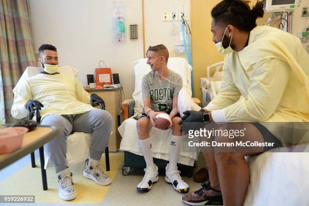 New England Patriots Kyle Van Noy and Harvey Langi visit Steven at Boston Children's Hospital on May 16, 2018 in Boston, Massachusetts.