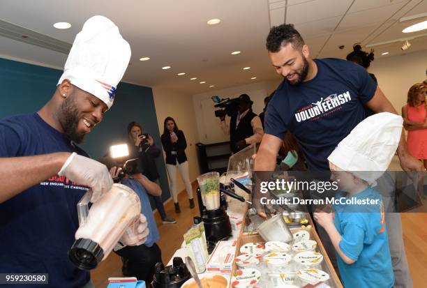 New England Patriots James White and Kyle Van Noy make smoothies with Daniel at Boston Children's Hospital on May 16, 2018 in Boston, Massachusetts.