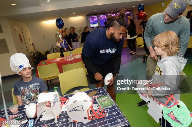 New England Patriots Harvey Langi visits with Evan and Zachary at Boston Children's Hospital on May 16, 2018 in Boston, Massachusetts.