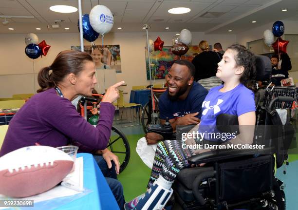 New England Patriots James White visits with Cambry and Mom at Boston Children's Hospital on May 16, 2018 in Boston, Massachusetts.