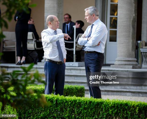 German Finance Minister Olaf Scholz welcomes his French counterpart Bruno Le Maire for talks at the Villa Borsig on May 16, 2018 in Berlin, Germany....