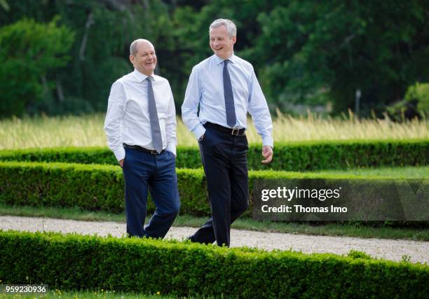 German Finance Minister Olaf Scholz welcomes his French counterpart Bruno Le Maire for talks at the Villa Borsig on May 16, 2018 in Berlin, Germany....