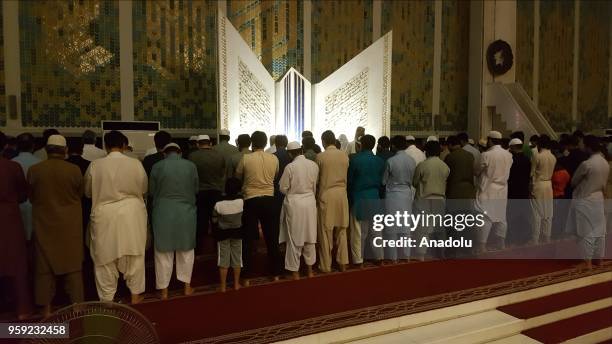 Muslims perform the first 'Tarawih' prayer on the eve of the Islamic Holy month of Ramadan at the Faisal Mosque in Islamabad, Pakistan on May 16,...