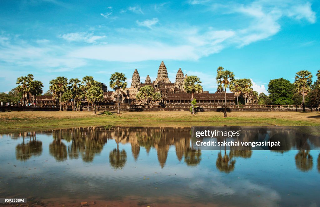 Angkor Wat Temple Against Sky During Sunset, Reflected in The Water, Siem Reap, Cambodia