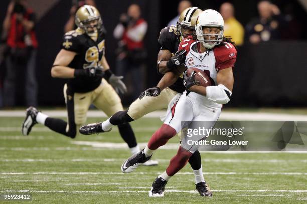 Arizona Cardinals wide receiver Larry Fitzgerald runs down field during the NFC Divisional Playoff Game against the New Orleans Saints at the...