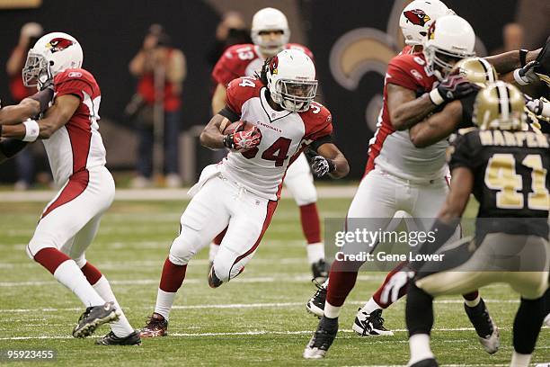 Arizona Cardinals running back Tim Hightower breaks the first play of the game for a touchdown during the NFC Divisional Playoff Game against the New...