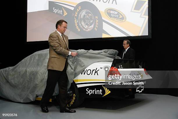 S Mike Fisher and Brett Bodine unveil a concept spoiler to be used in an upcoming on-track test, during the NASCAR Sprint Media Tour hosted by...