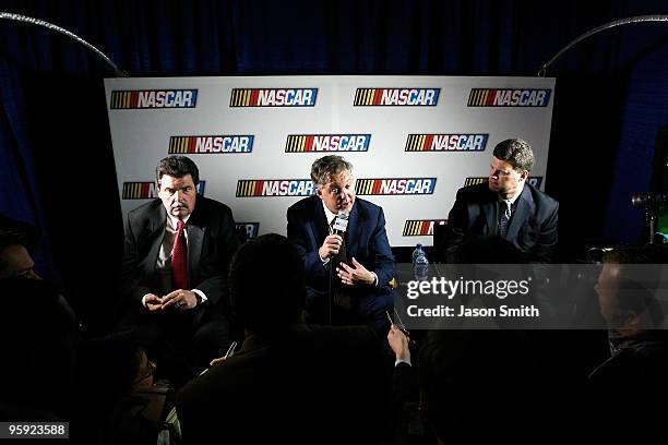 Chairman and CEO Brian France speaks with the media, as President Mike Helton , and Senior Vice President of Racing Operations Steve O'Donnell look...