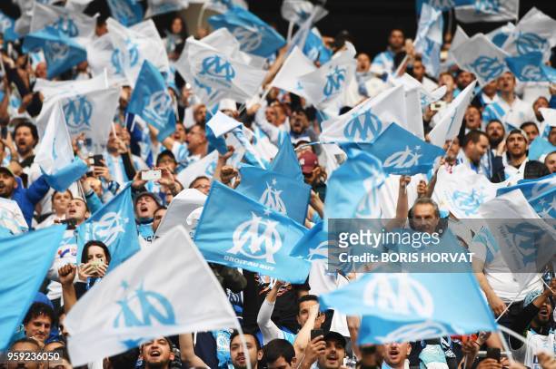 Marseille's fans wave flags before the UEFA Europa League final football match between Olympique de Marseille and Club Atletico de Madrid at the Parc...